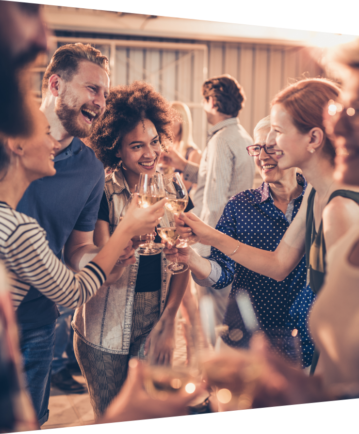 a group of friends holding wine glasses